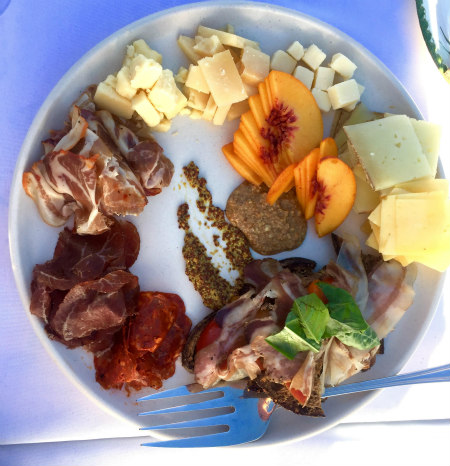 Charcuterie, cheese and stone fruit platter.