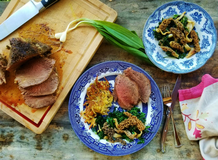 A late spring meal of beef sirloin tip roast from the author’s steers, hash browned potatoes stored from last summer’s harvest, and the Trinity of Foraging, a warm salad of morels, ramps and watercress.