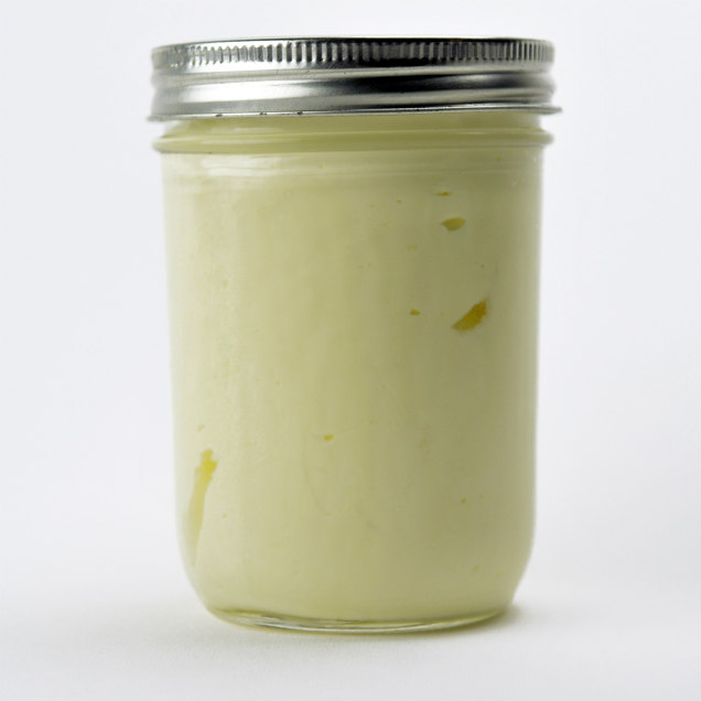 Mason jar filled with freshly shaken DIY butter.