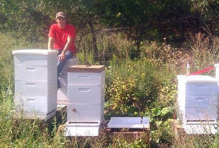 Matt LaForge with a few of his many hives.