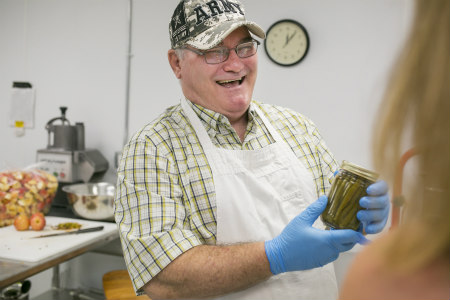 An Army veteran is enjoying making dilly beans for Porchlight Products. Photo by Beth Skogen Photography, for Porchlight