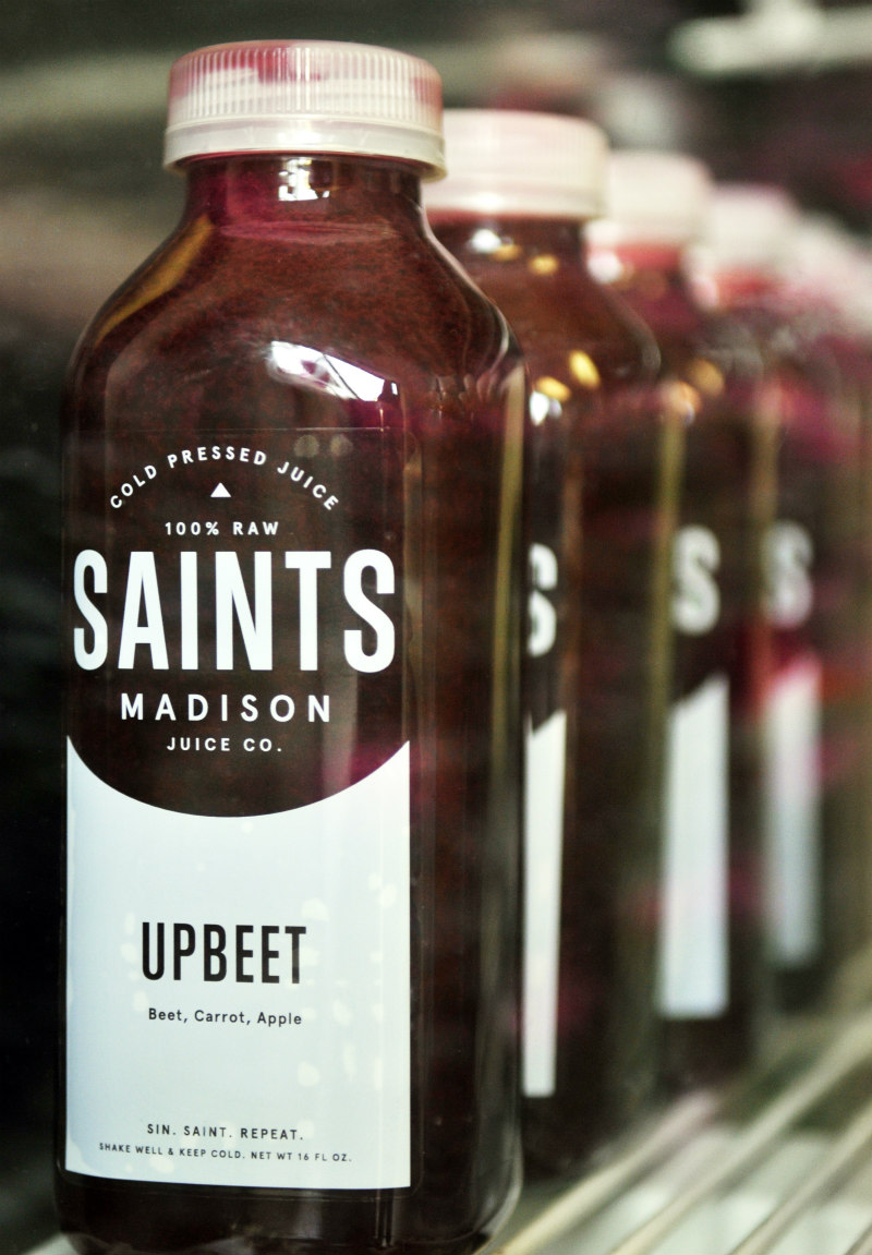 A bottle of deep red juice called Upbeet by Saints.