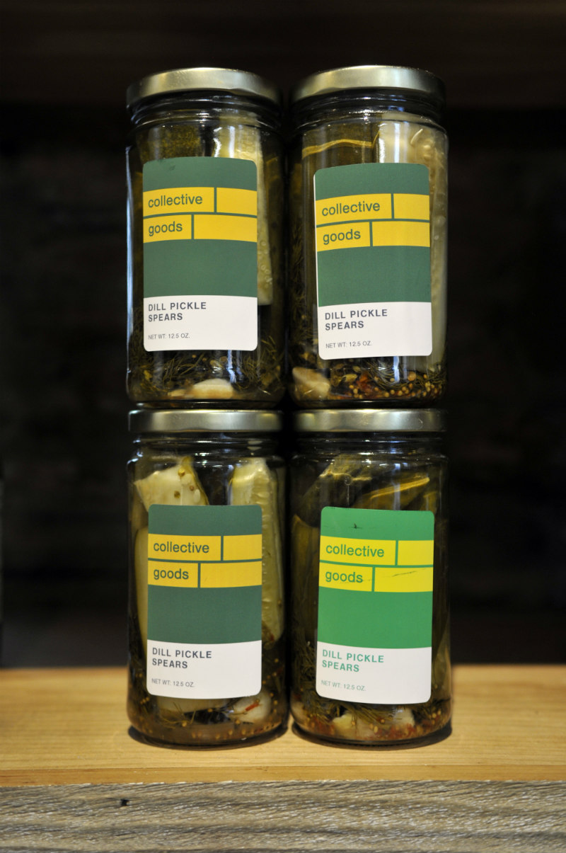 Bottles of Collective Goods dill pickle spears.