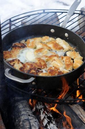 Shore lunch cooked outdoors on the lakeshore.